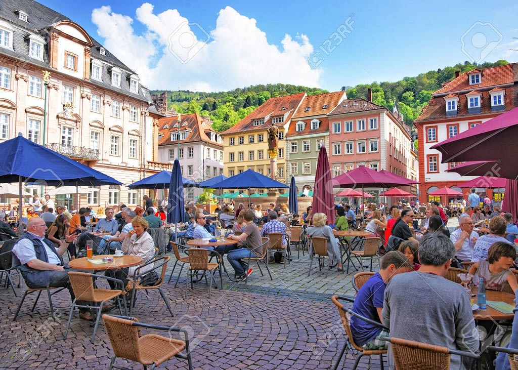 Marketplace crowded with tourists and Town Hall in Heidelberg